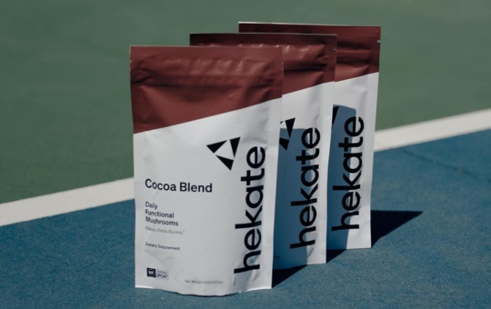 Tennis court with three bags of Hekate cocoa blend